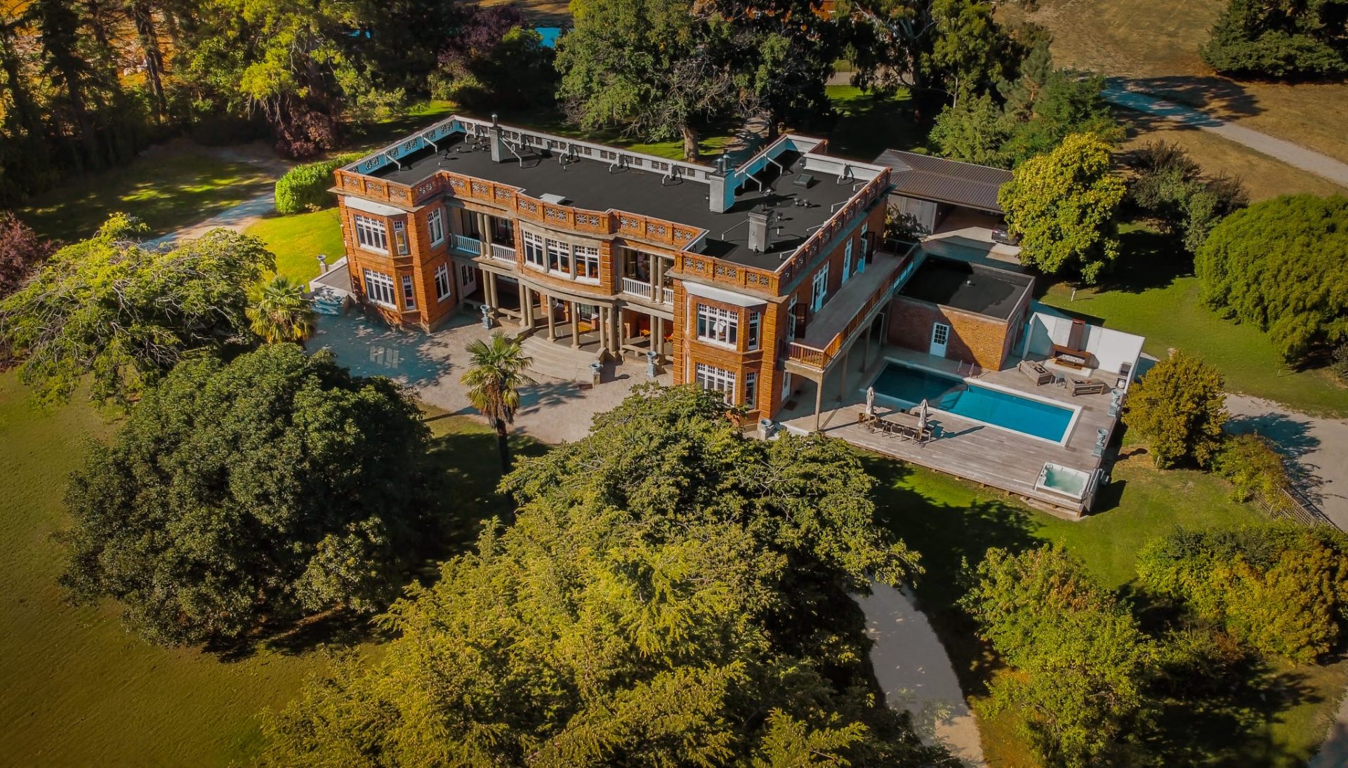 Aerial view of Earnscleugh Castle, a heritage luxury stay in Central Otago